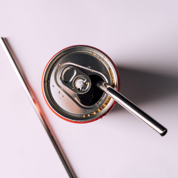 Carbonated,Soda,In,Can,,Metal,Reusable,Cocktail,Straw,On,White