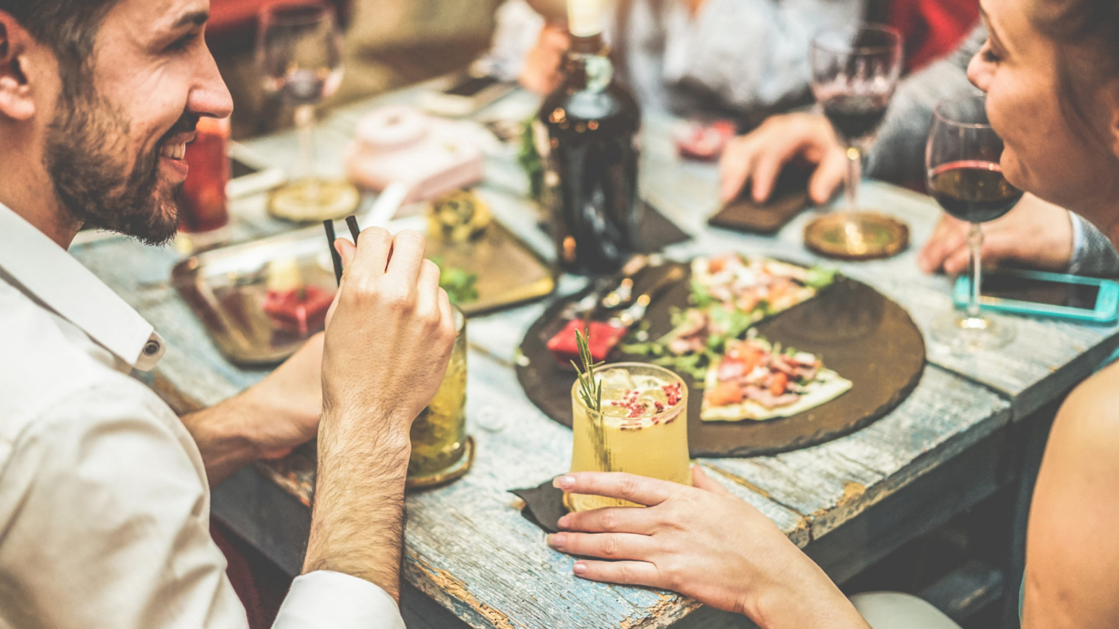 Young,Friends,Enjoying,Stylish,Cocktails,In,Speakeasy,Bar,-,Young