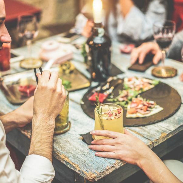 Young,Friends,Enjoying,Stylish,Cocktails,In,Speakeasy,Bar,-,Young